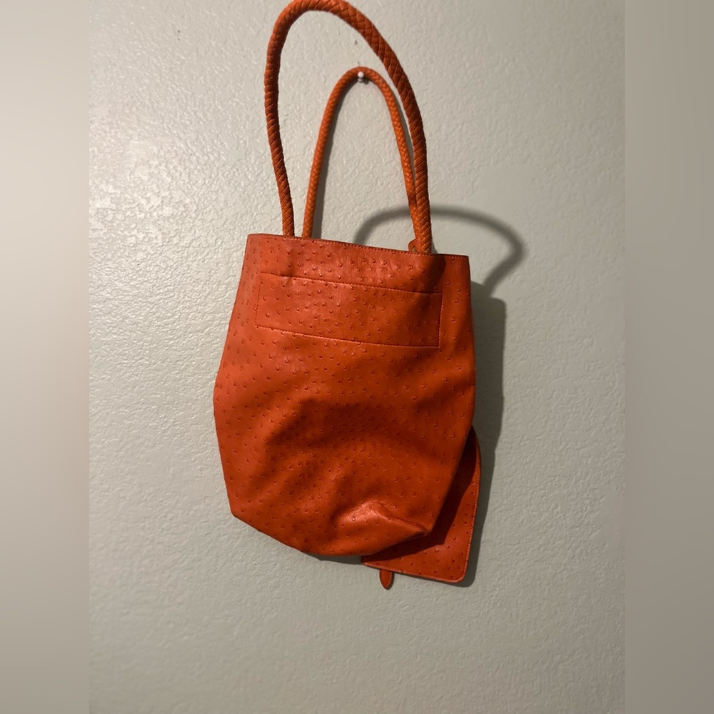 Orange shoulder purse with small bag